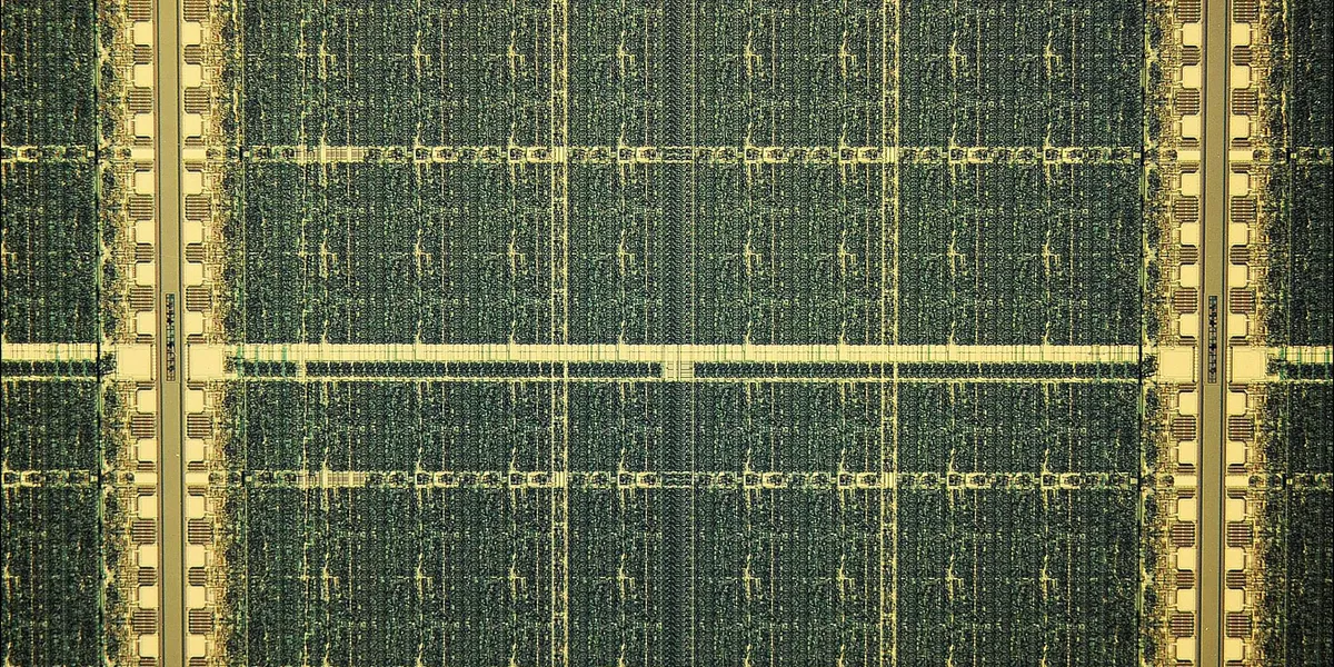 The FPGA Chip Is an IEEE Milestone die photo of an integrated circuit with an 8 by 8 array